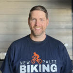 Craig Chapman headshot he is wearing a New Paltz Biking shirt
