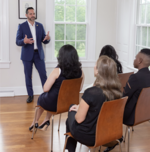 Michael Esposito speaking to a group of women in a public speaking workshop